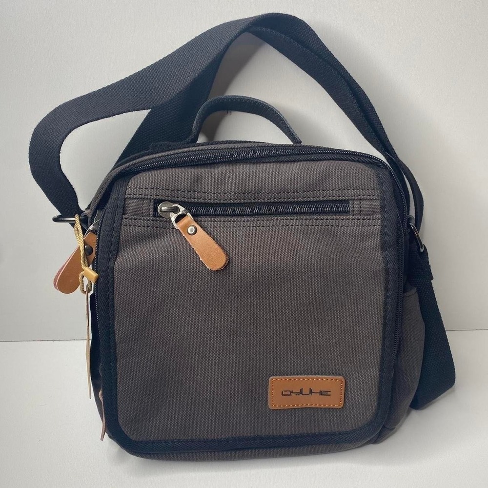 Brand new with tags. Unisex Canvas Utility Messenger Style Crossbody Tool Bag